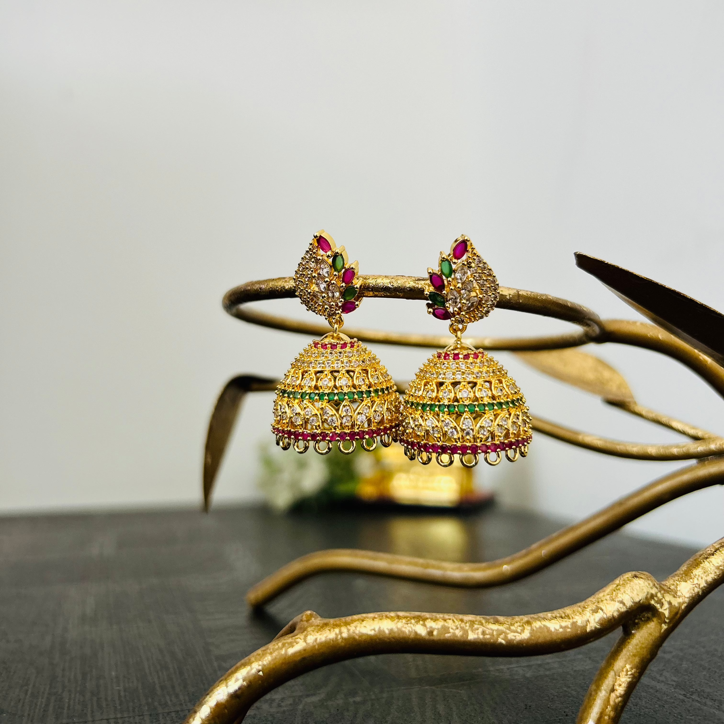Jhumka Earrings in Microgold Finish